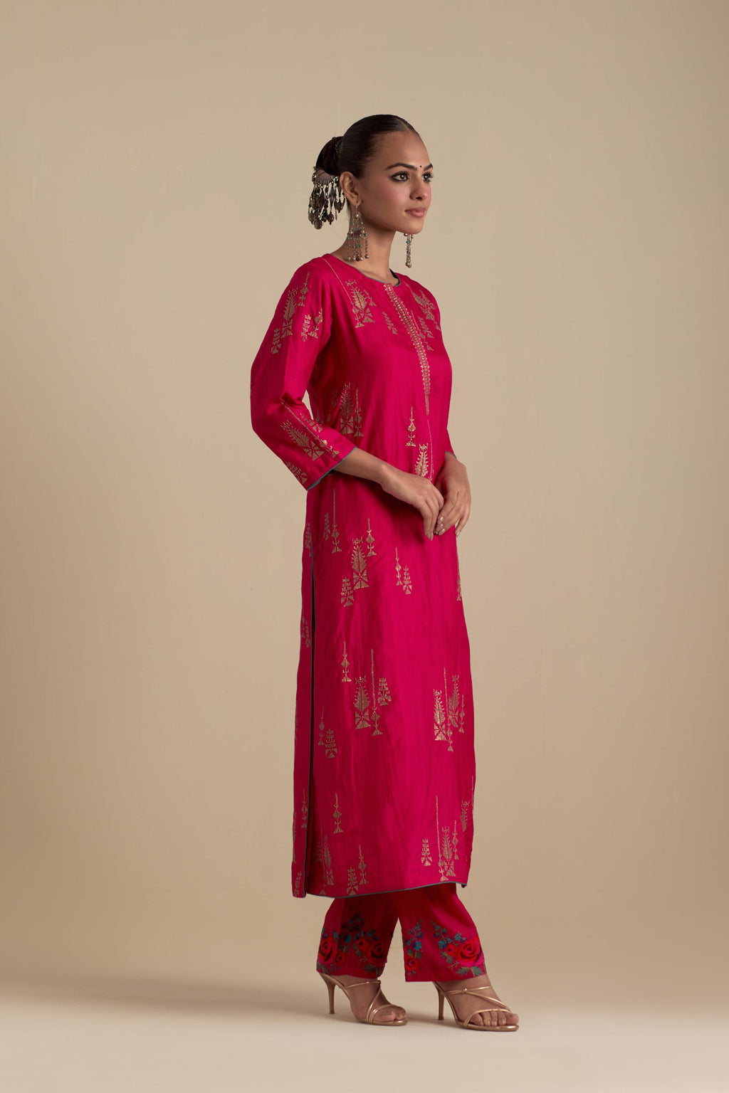 Fuchsia silk straight kurta set, highlighted with dull gold zari and sequins handwork.