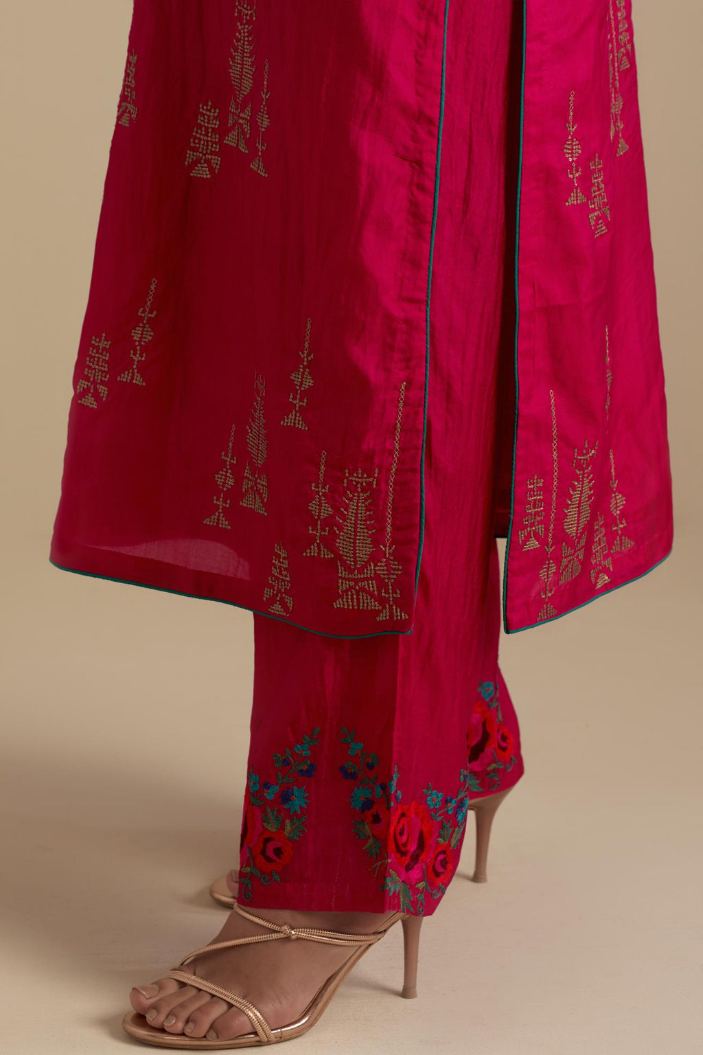 Fuchsia silk straight kurta set, highlighted with dull gold zari and sequins handwork.