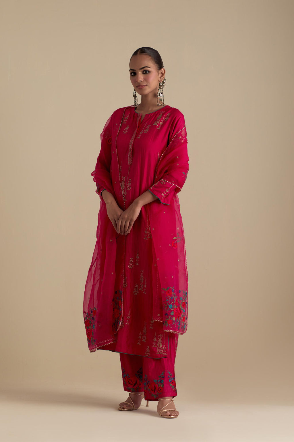 Fuchsia silk straight kurta set, highlighted with dull gold zari and sequins handwork.