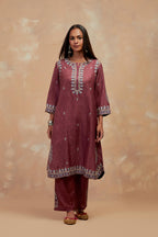 Deep berry silk hand block printed short kurta set with round hem and multi colored silk thread embroidery all over the kurta.