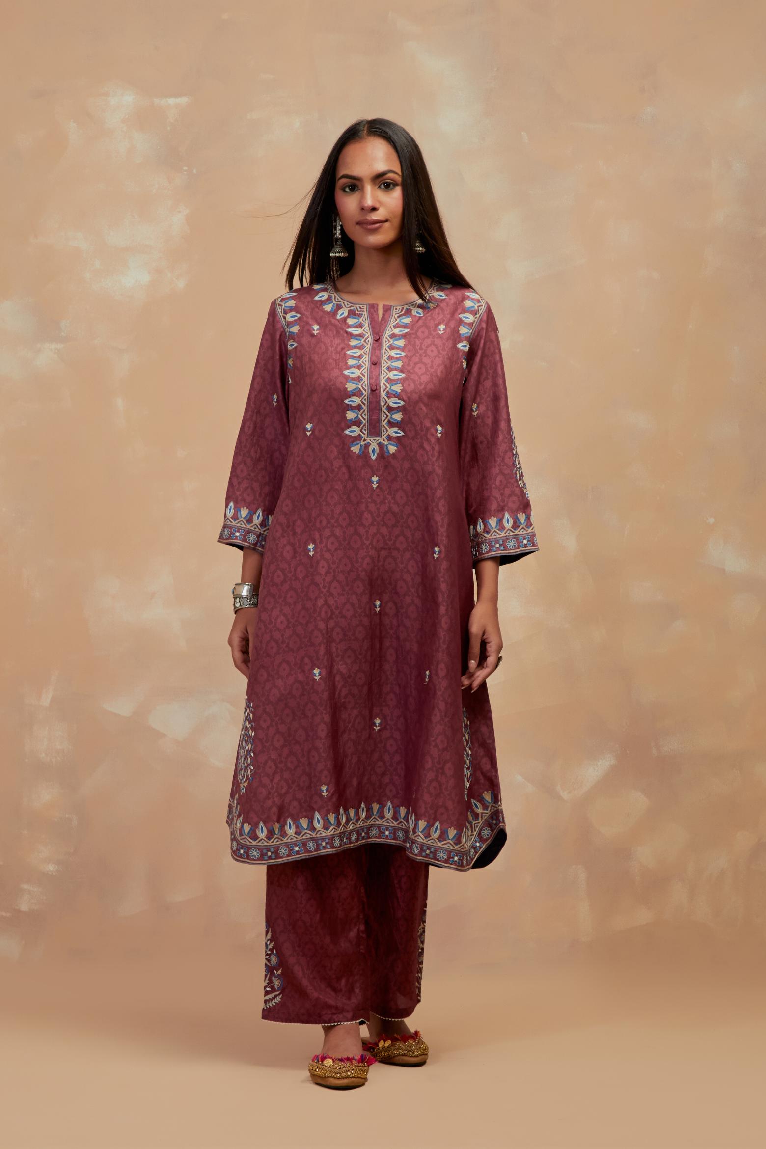 Deep berry silk hand block printed short kurta set with round hem and multi colored silk thread embroidery all over the kurta.
