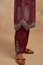 Deep berry silk hand block printed short kurta set with round hem and multi colored silk thread embroidery all over the kurta.