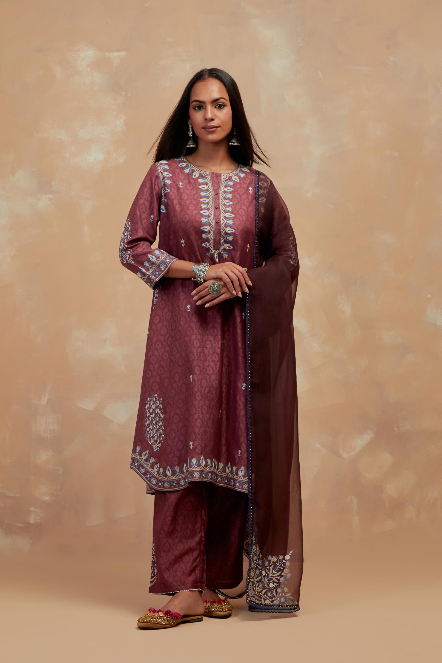 Deep berry silk hand block printed short kurta set with round hem and multi colored silk thread embroidery all over the kurta.