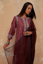 Deep berry silk hand block printed short kurta set with round hem and multi colored silk thread embroidery all over the kurta.