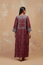 Deep berry silk hand block printed A-line long kurta set with all-over multi colored thread embroidery.