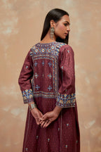Deep berry silk hand block printed A-line long kurta set with all-over multi colored thread embroidery.