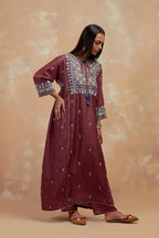 Deep berry silk hand block printed A-line long kurta set with all-over multi colored thread embroidery.