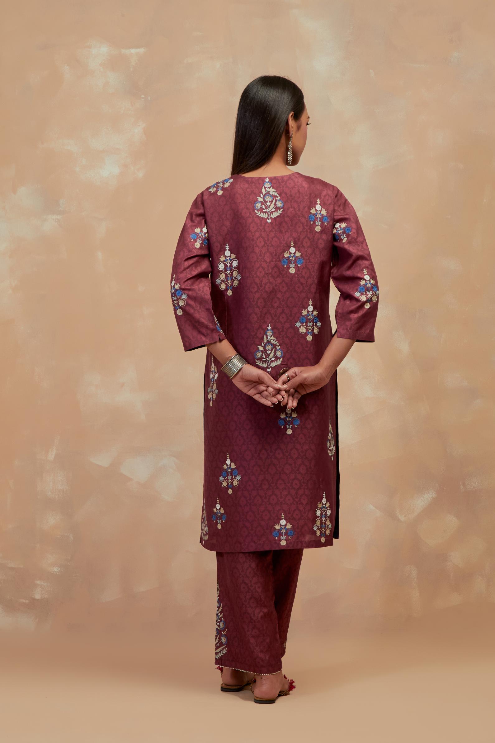 Deep berry silk hand block printed short kurta set, highlighted with multi colored silk thread embroidery.