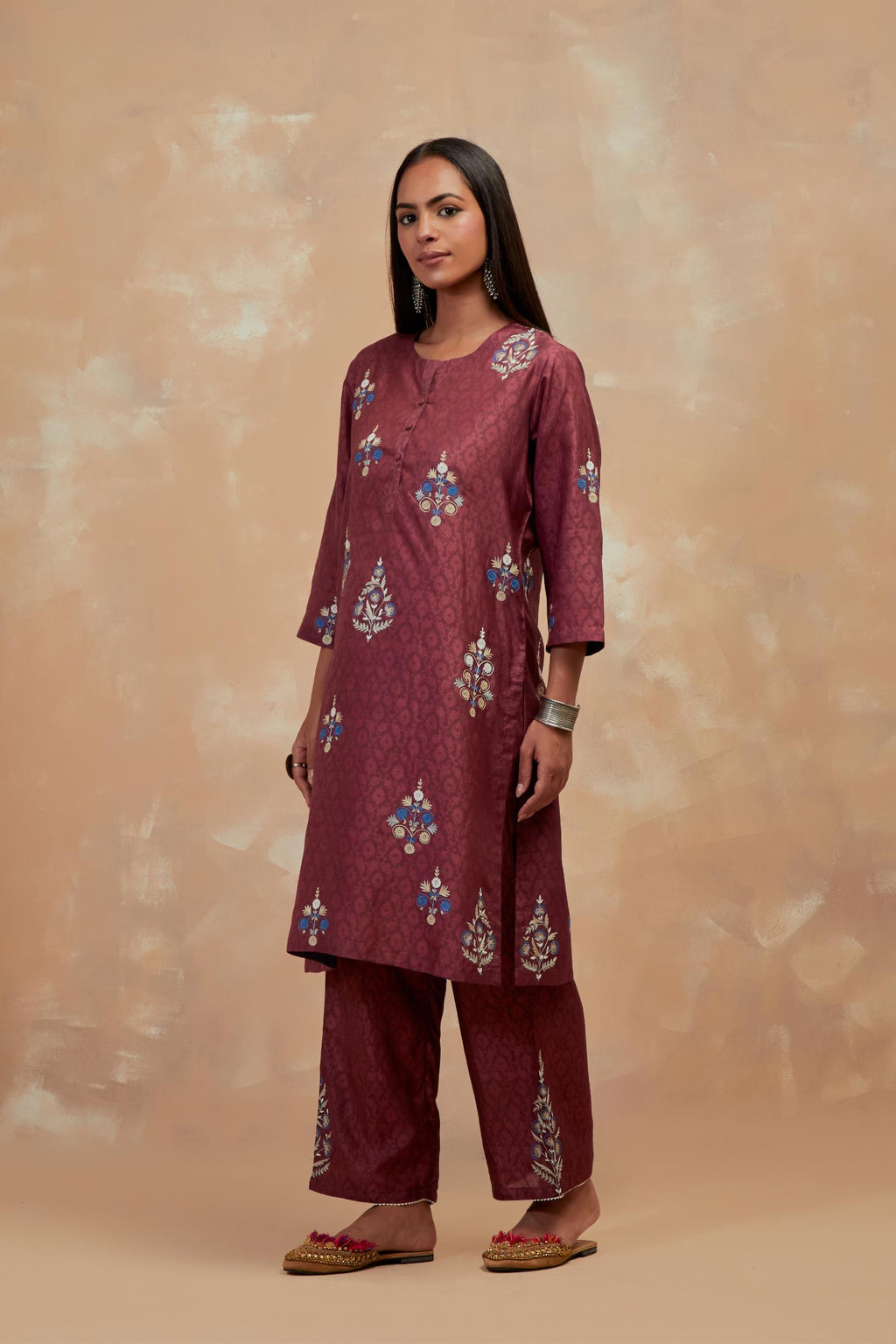 Deep berry silk hand block printed short kurta set, highlighted with multi colored silk thread embroidery.