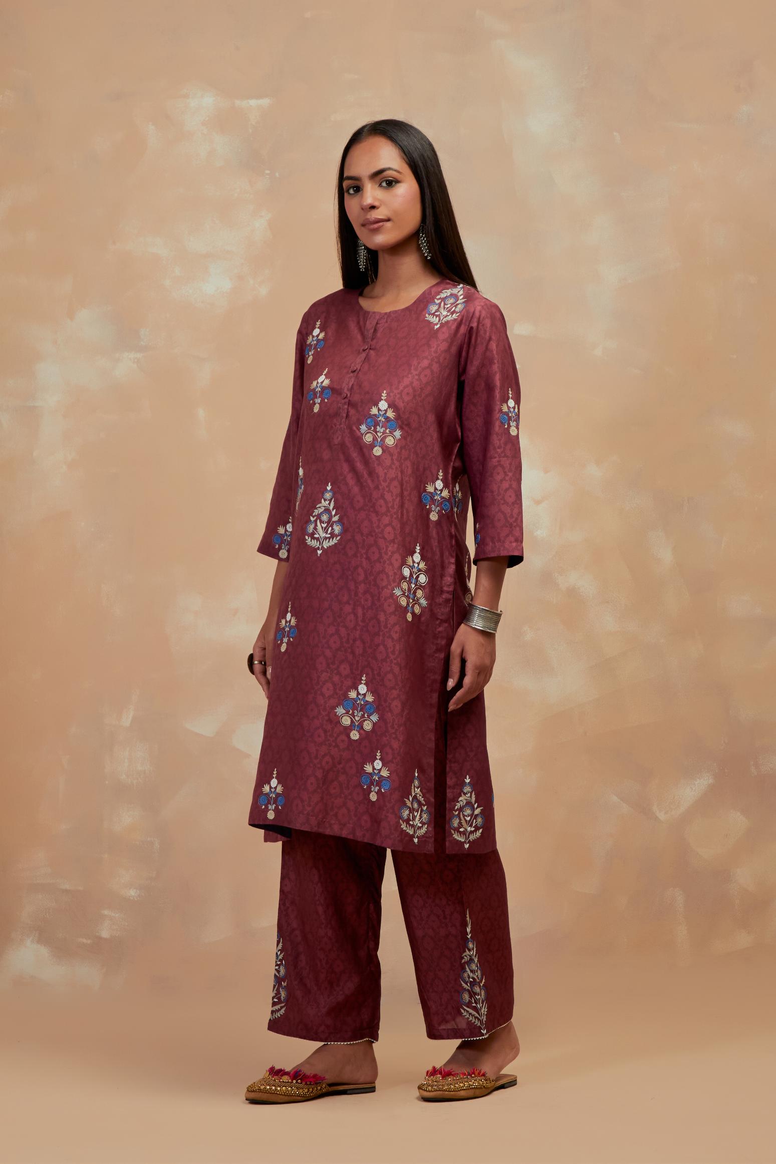 Deep berry silk hand block printed short kurta set, highlighted with multi colored silk thread embroidery.