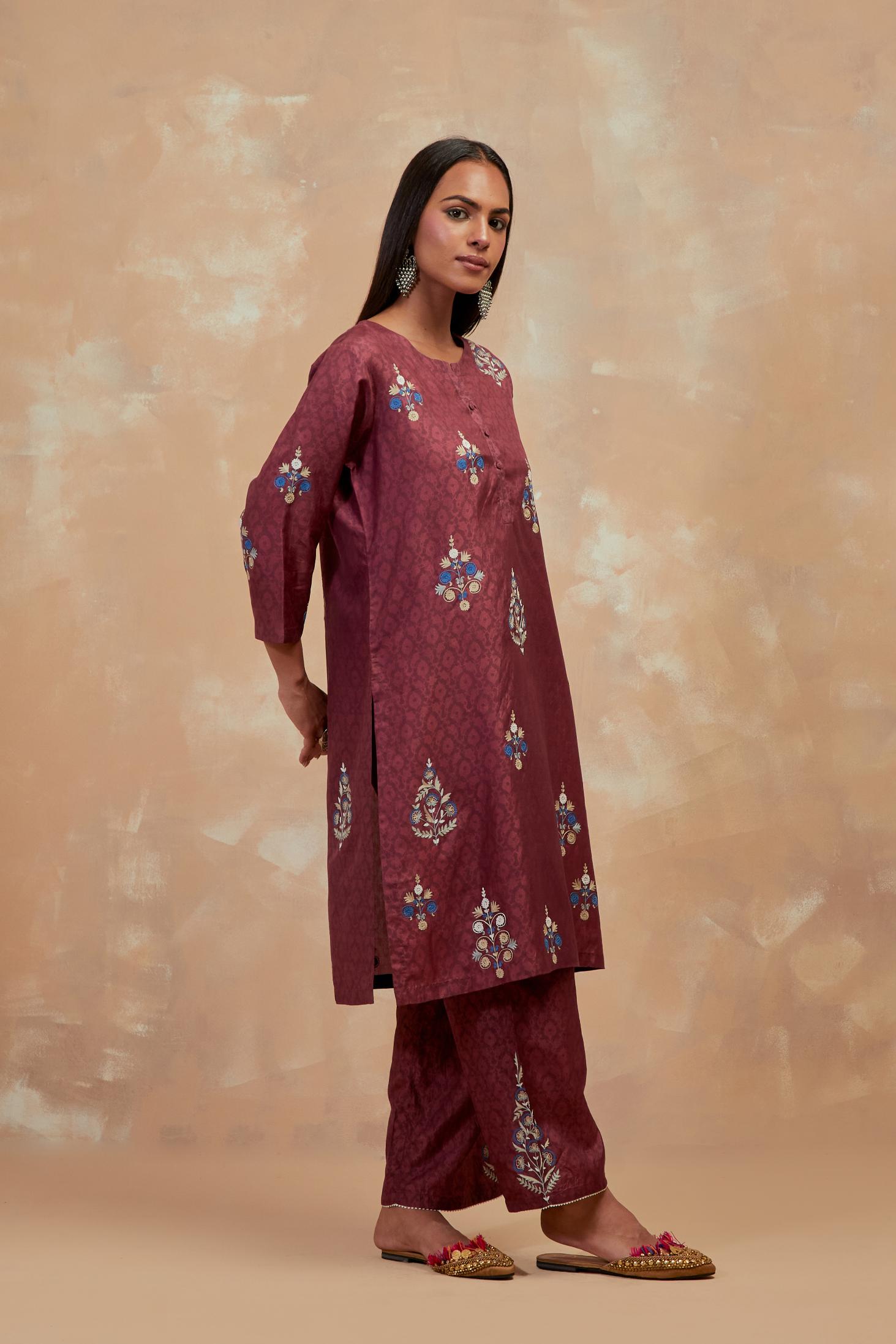 Deep berry silk hand block printed short kurta set, highlighted with multi colored silk thread embroidery.