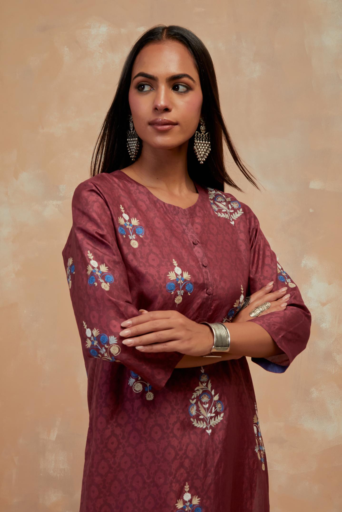 Deep berry silk hand block printed short kurta set, highlighted with multi colored silk thread embroidery.
