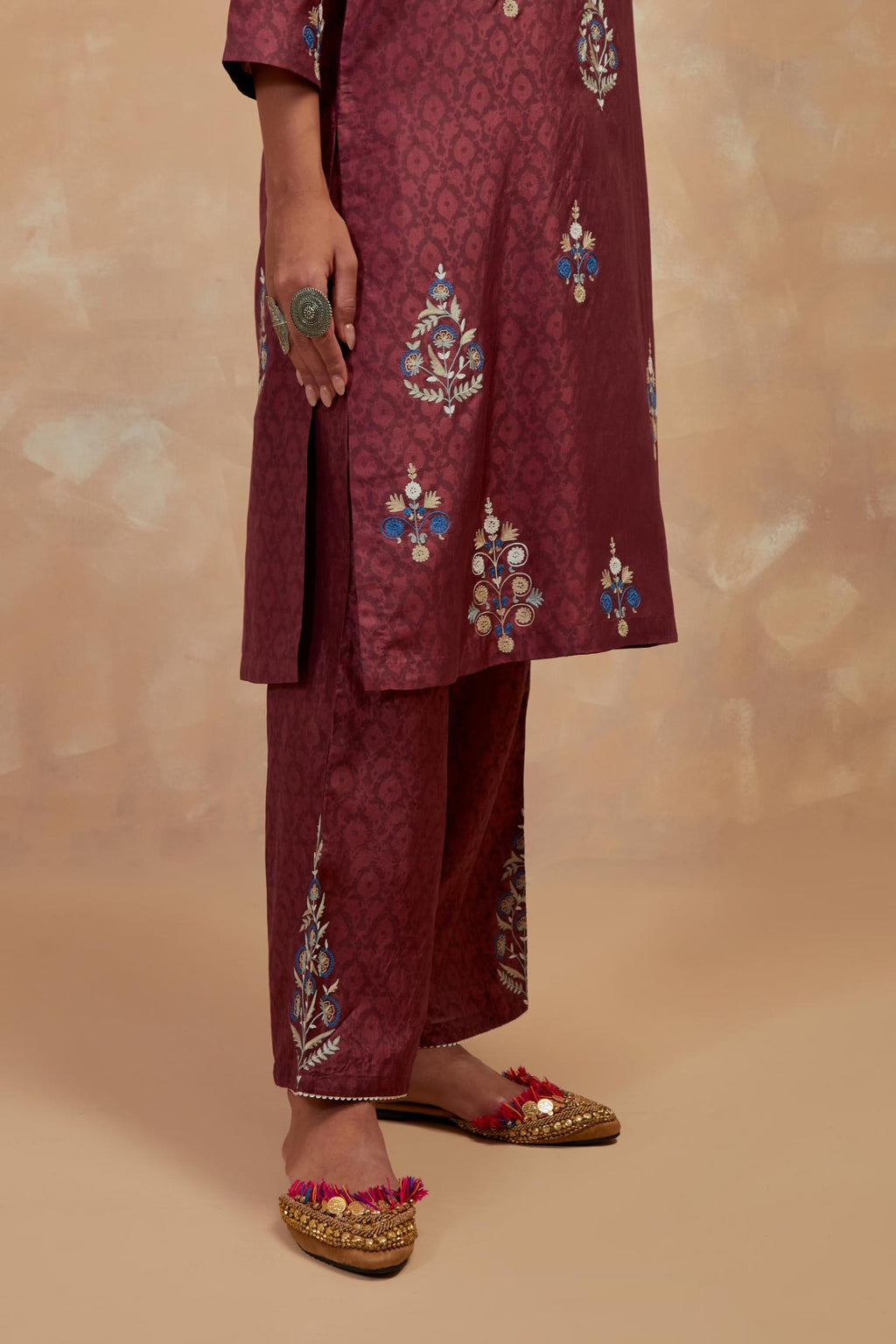 Deep berry silk hand block printed short kurta set, highlighted with multi colored silk thread embroidery.