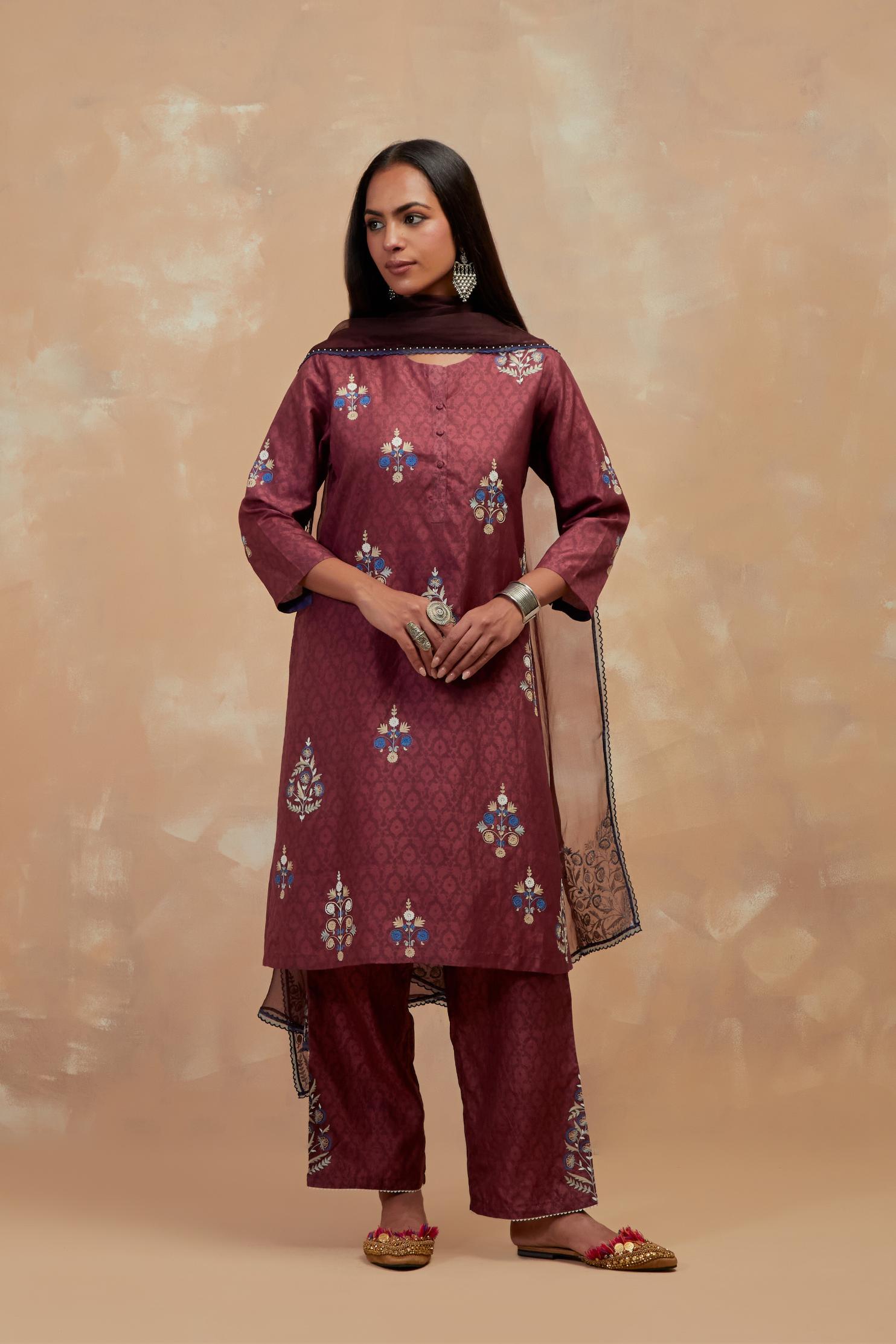 Deep berry silk hand block printed short kurta set, highlighted with multi colored silk thread embroidery.