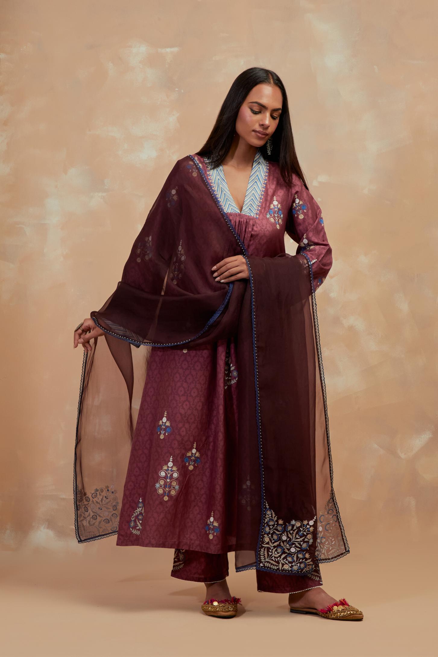 Deep berry silk hand block printed easy fit kurta set, highlighted multicolored silk thread embroidery.