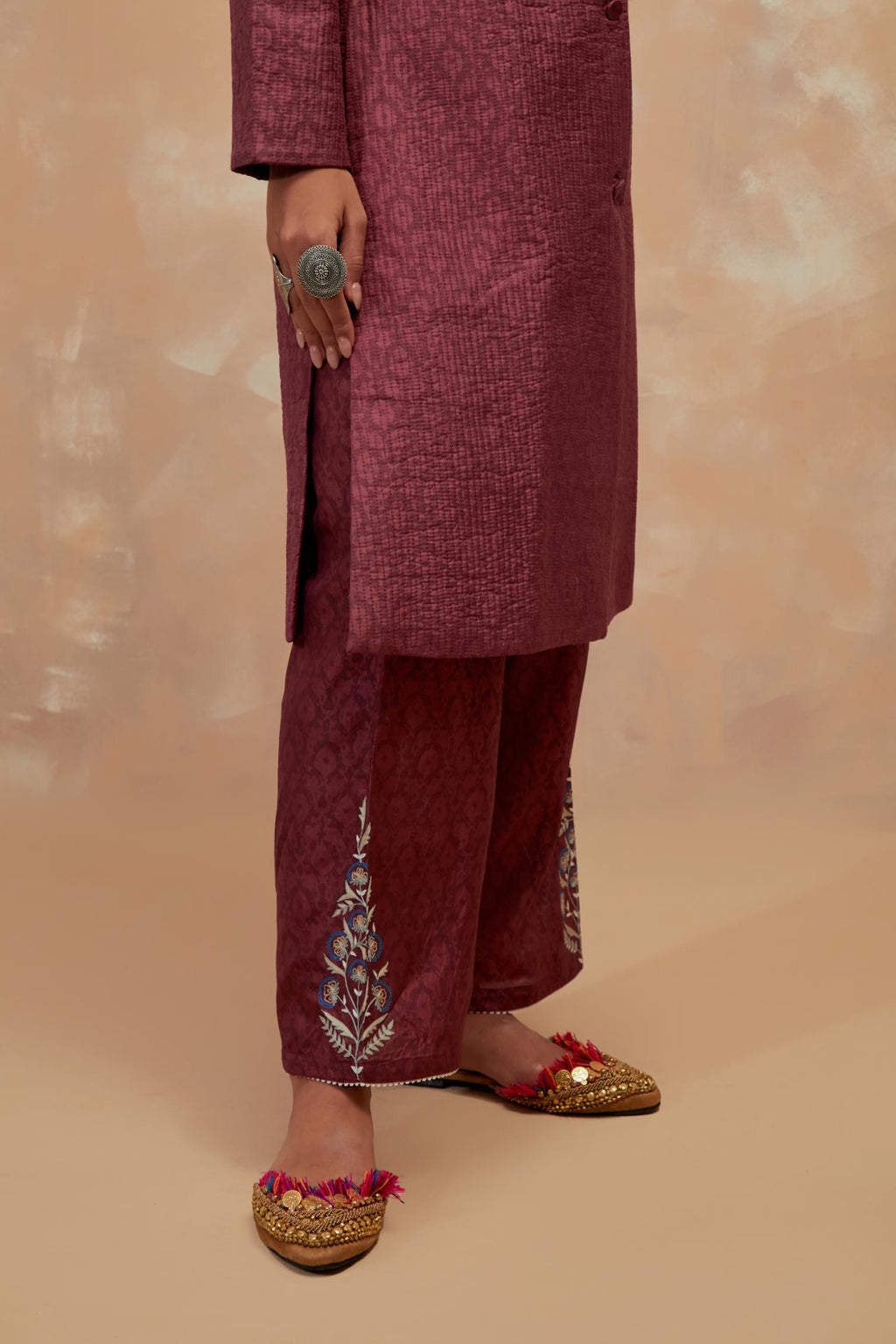 Deep berry silk, quilted mid- length front open jacket with all-over hand block print.
