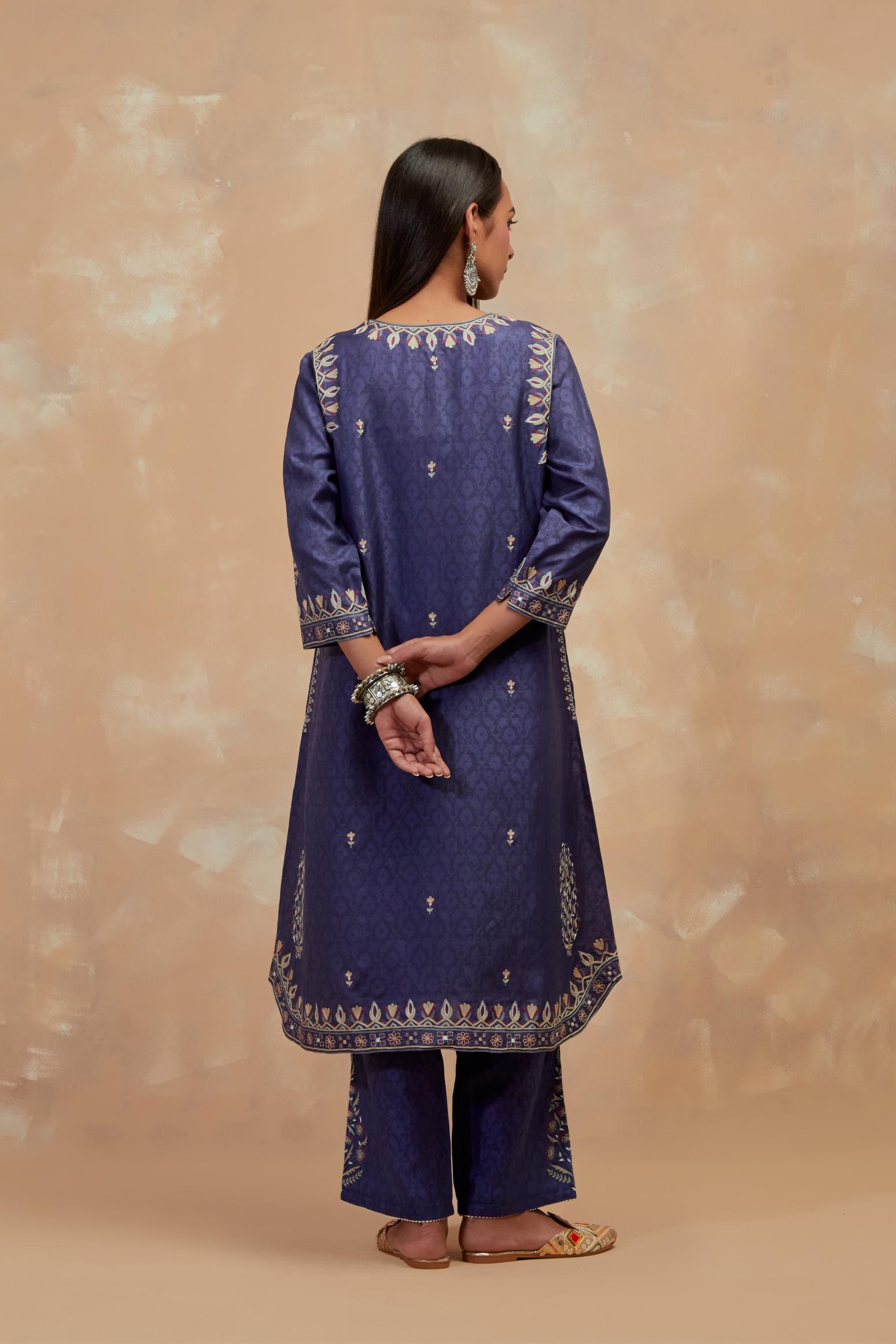 Ford blue silk hand block printed short kurta set with round hem and multi colored silk thread embroidery all over the kurta.