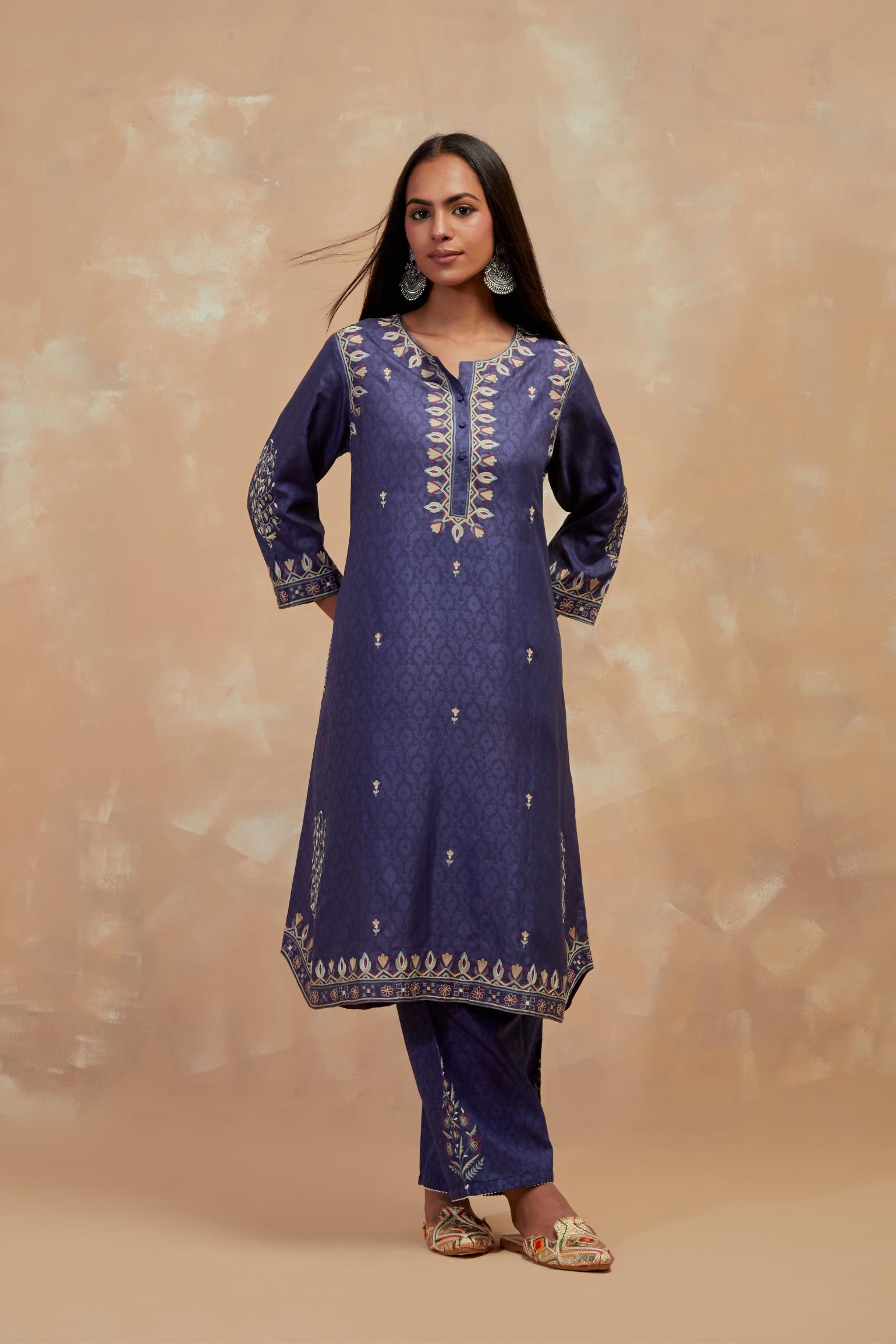 Ford blue silk hand block printed short kurta set with round hem and multi colored silk thread embroidery all over the kurta.