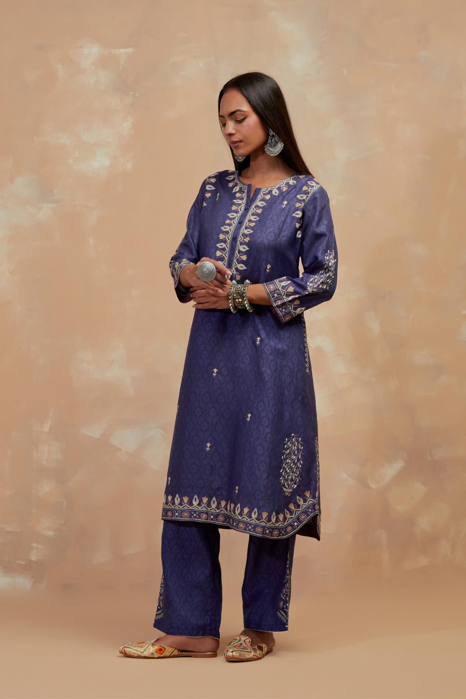 Ford blue silk hand block printed short kurta set with round hem and multi colored silk thread embroidery all over the kurta.