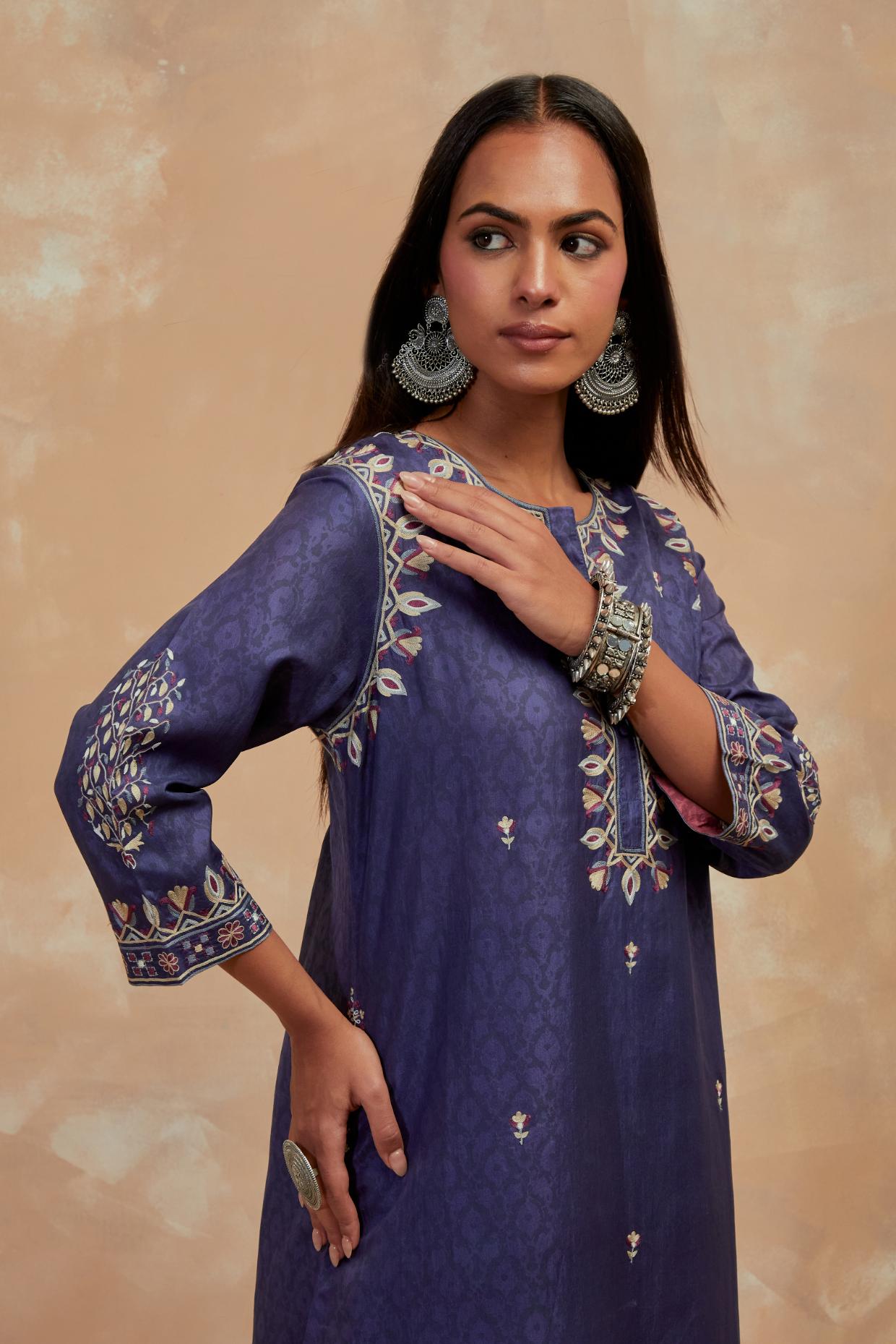 Ford blue silk hand block printed short kurta set with round hem and multi colored silk thread embroidery all over the kurta.