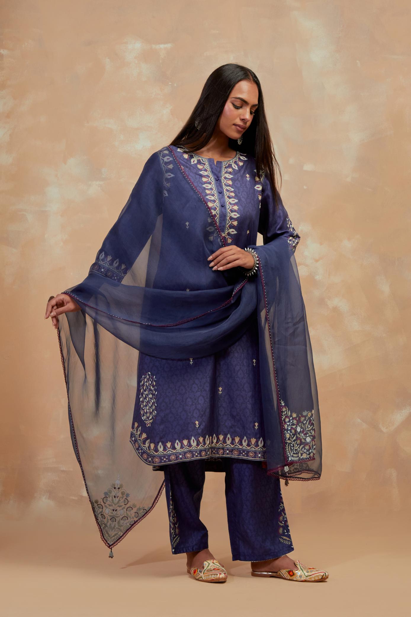 Ford blue silk hand block printed short kurta set with round hem and multi colored silk thread embroidery all over the kurta.