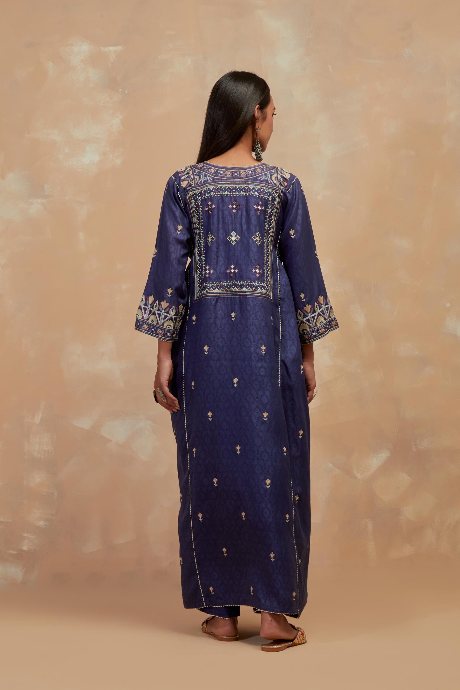 Ford blue silk hand block printed A-line long kurta set with all-over multi colored thread embroidery.