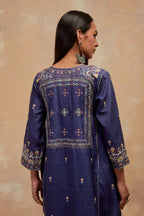 Ford blue silk hand block printed A-line long kurta set with all-over multi colored thread embroidery.