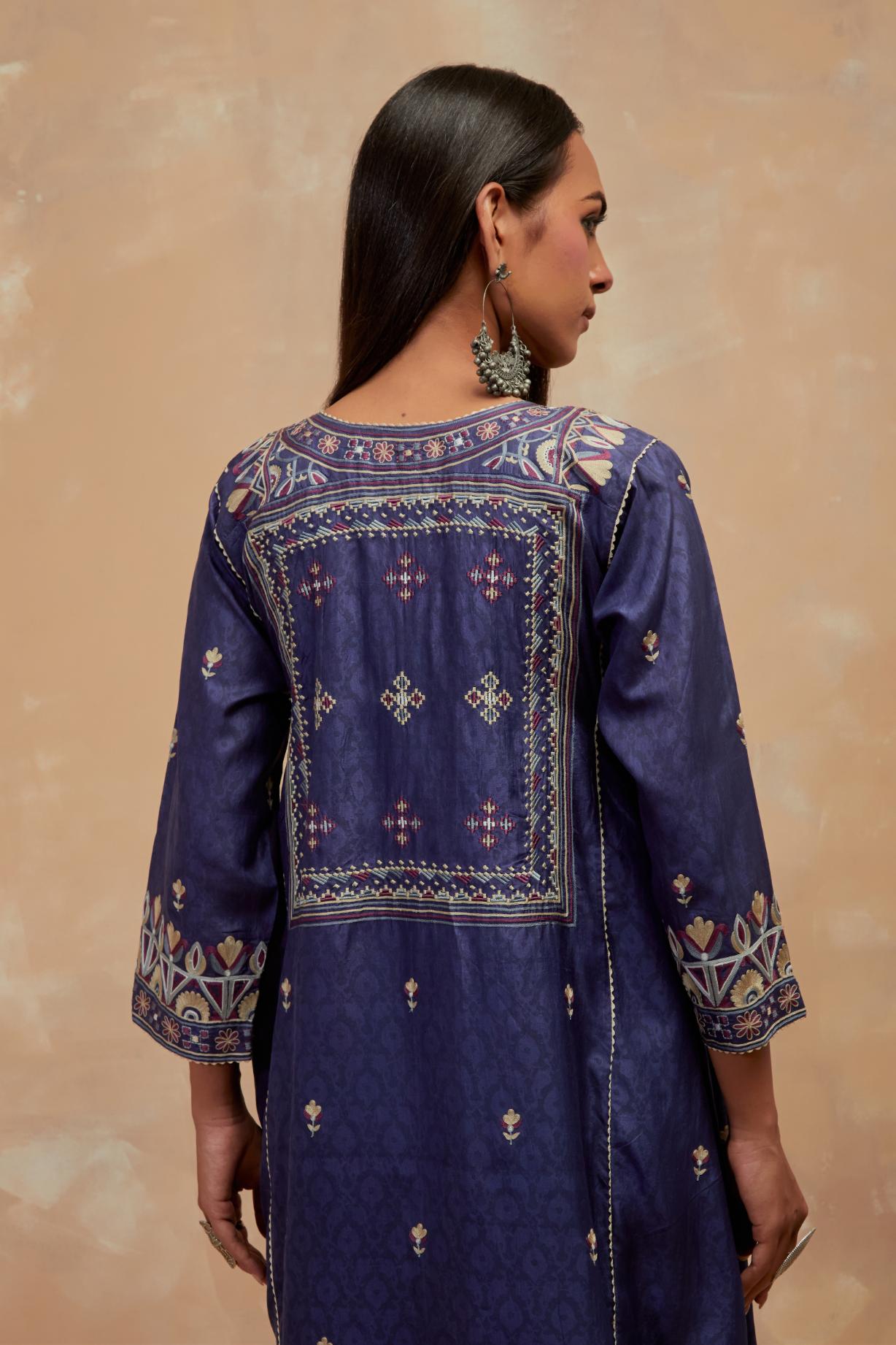 Ford blue silk hand block printed A-line long kurta set with all-over multi colored thread embroidery.