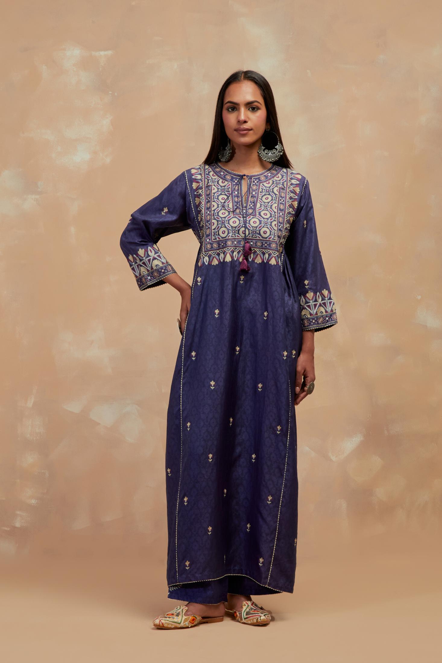 Ford blue silk hand block printed A-line long kurta set with all-over multi colored thread embroidery.