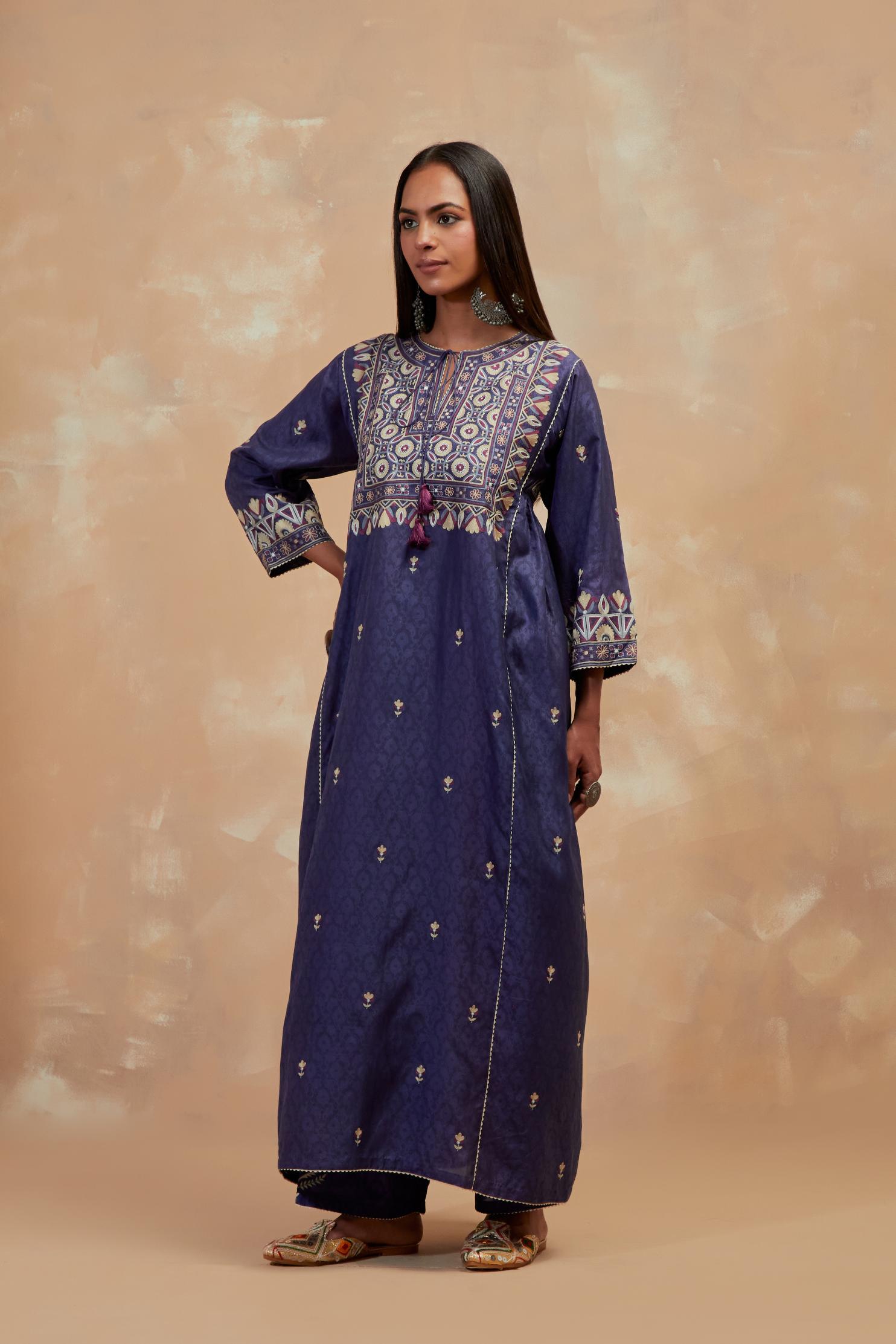 Ford blue silk hand block printed A-line long kurta set with all-over multi colored thread embroidery.