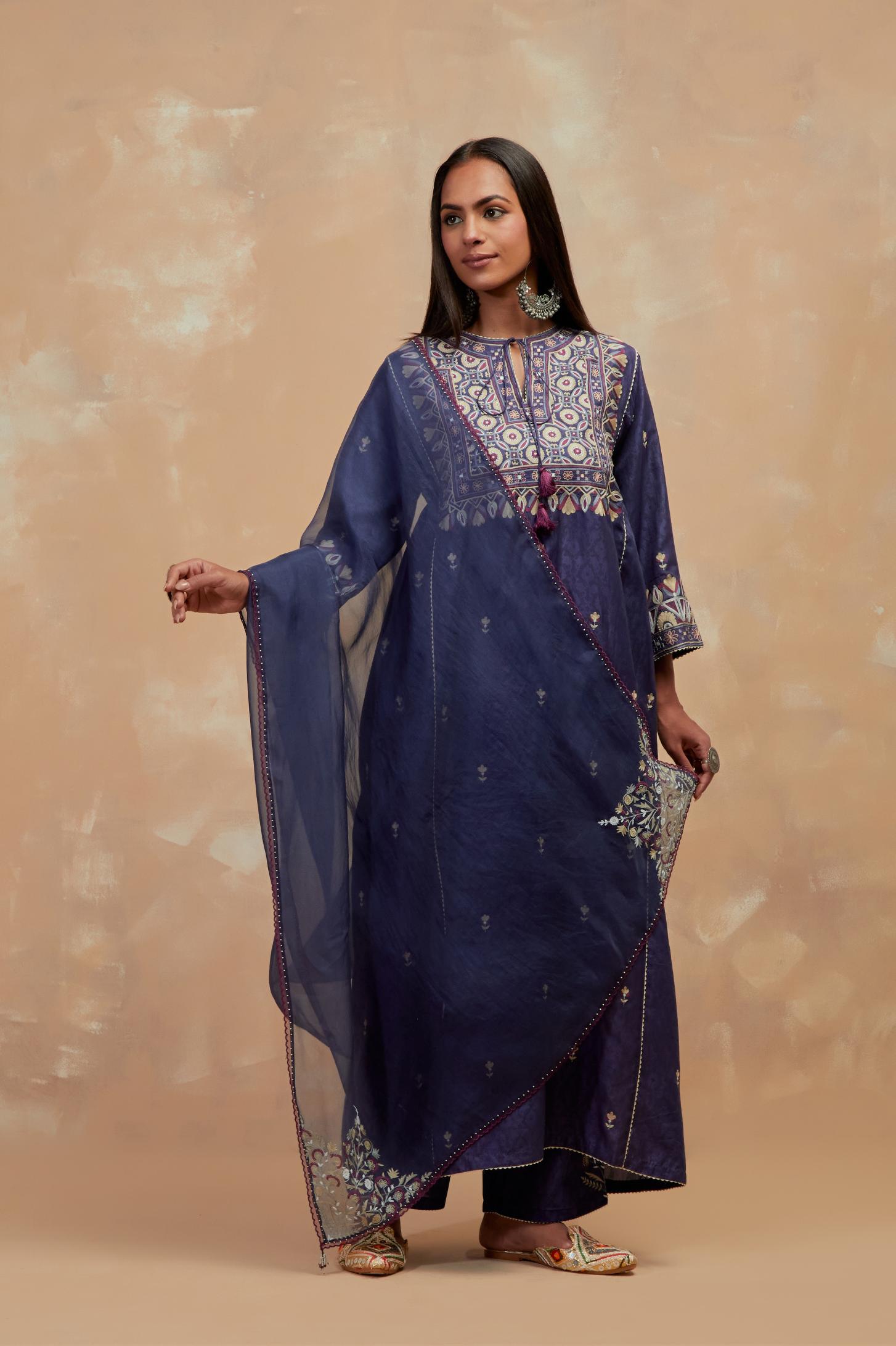 Ford blue silk hand block printed A-line long kurta set with all-over multi colored thread embroidery.