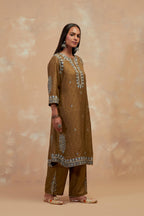 Olive green silk hand block printed short kurta set with round hem and multi colored silk thread embroidery all over the kurta.