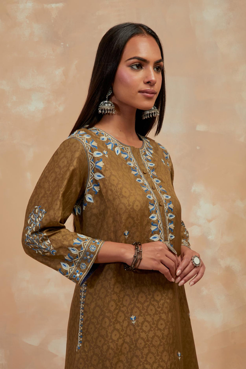 Olive green silk hand block printed short kurta set with round hem and multi colored silk thread embroidery all over the kurta.