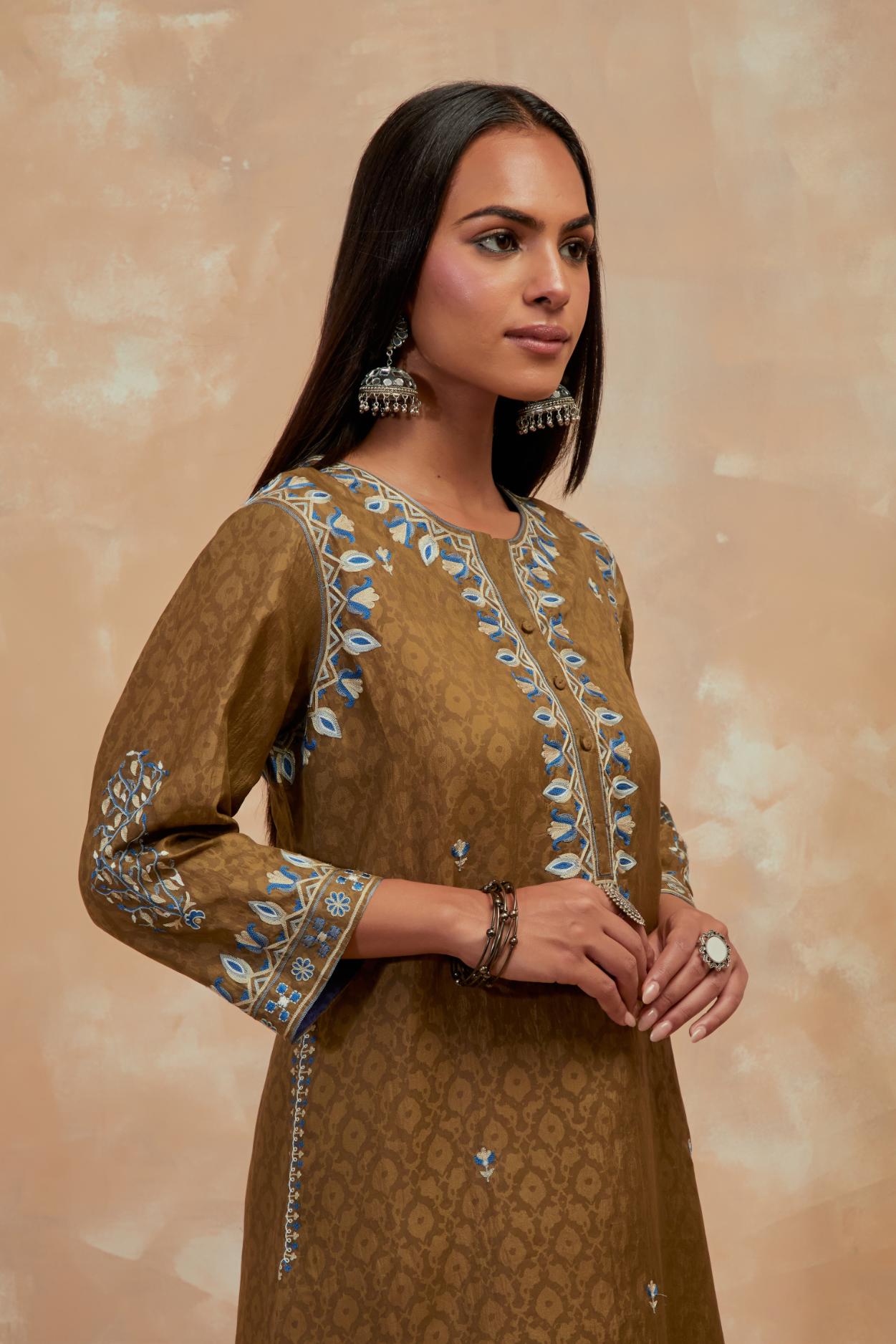 Olive green silk hand block printed short kurta set with round hem and multi colored silk thread embroidery all over the kurta.