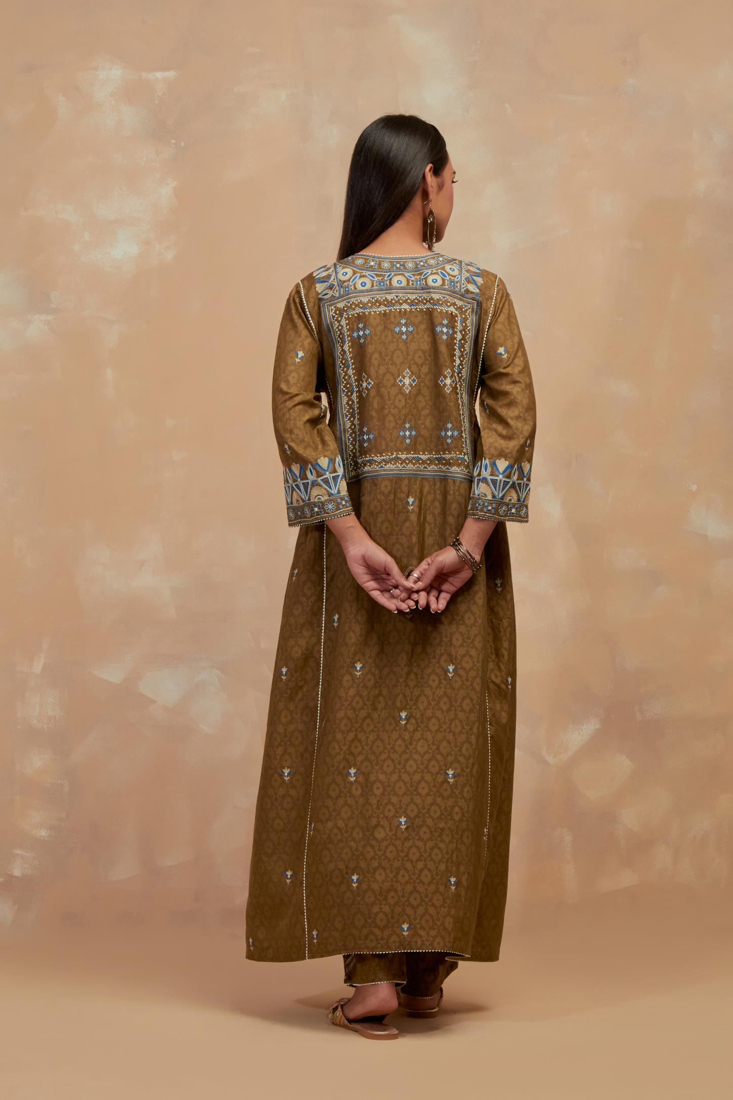 Olive green silk hand block printed A-line long kurta set with all-over multi colored thread embroidery.