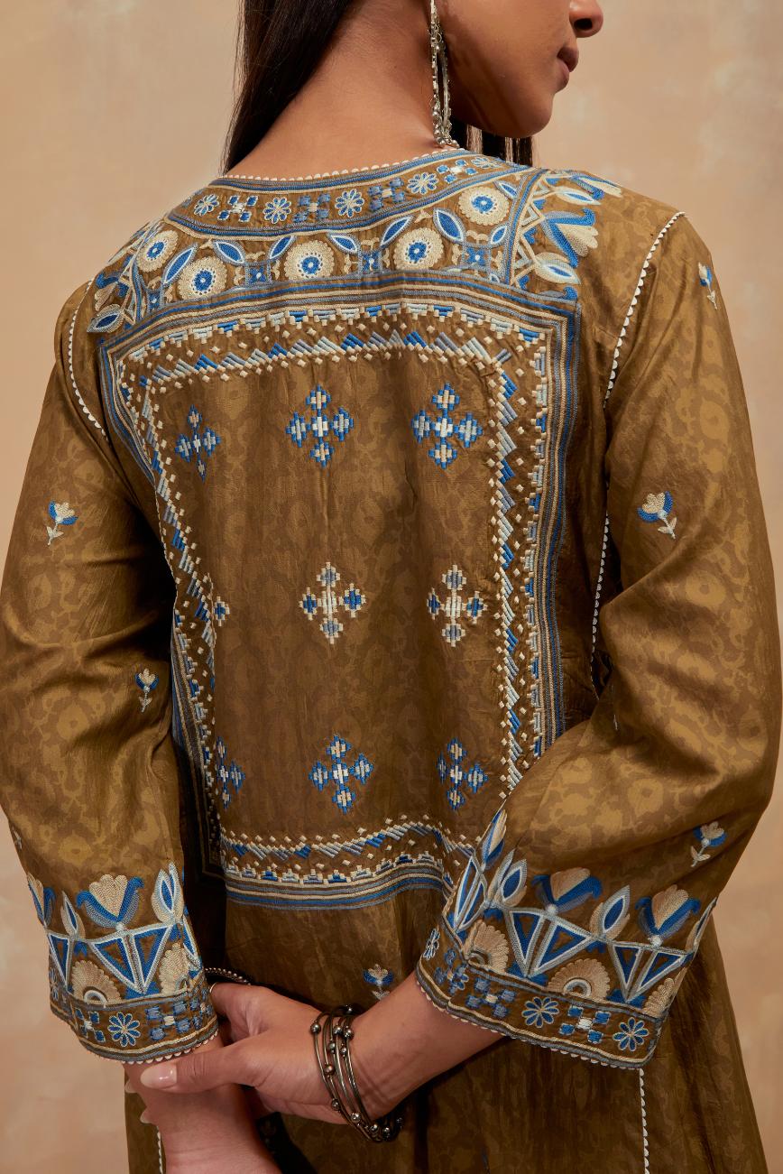Olive green silk hand block printed A-line long kurta set with all-over multi colored thread embroidery.