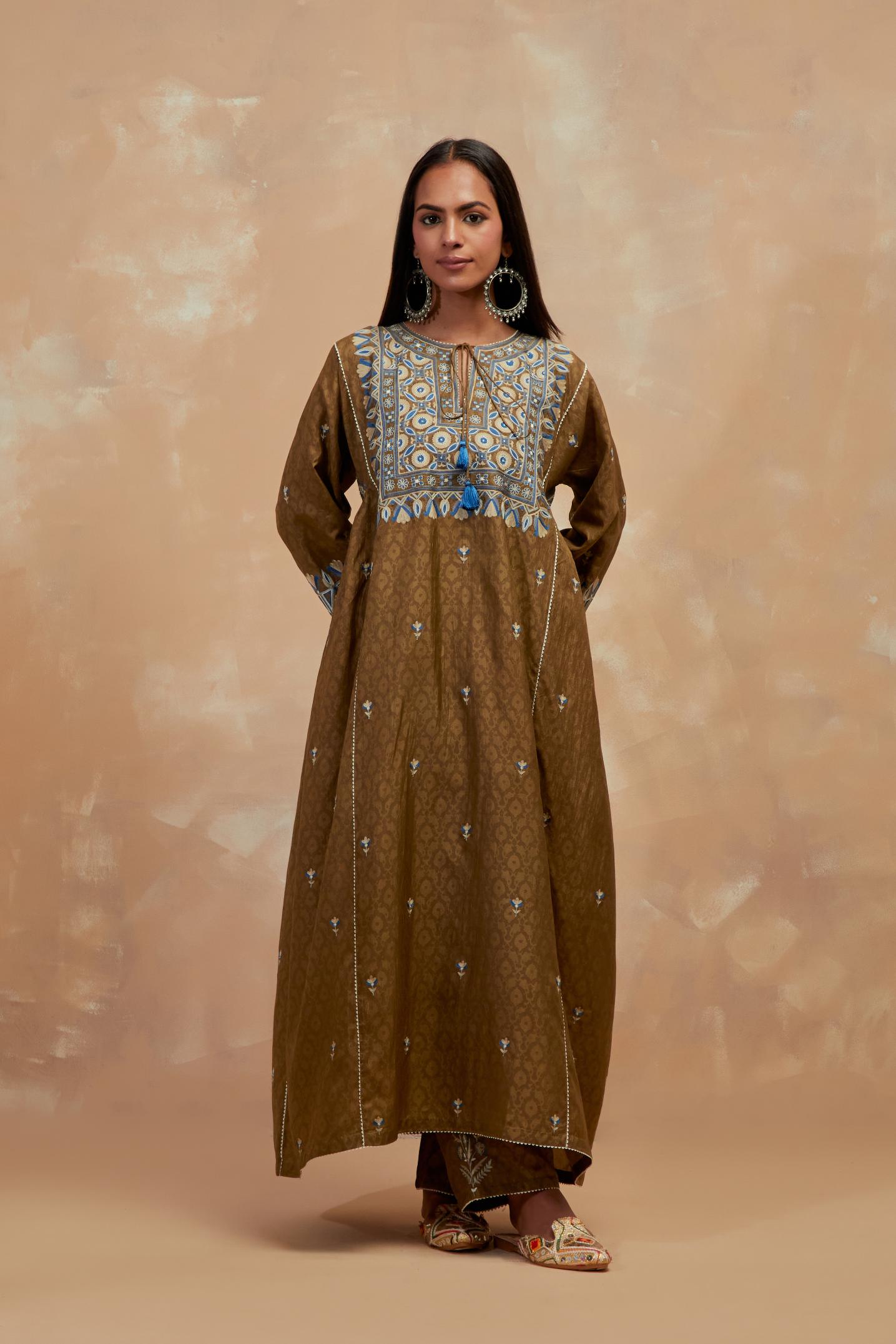 Olive green silk hand block printed A-line long kurta set with all-over multi colored thread embroidery.