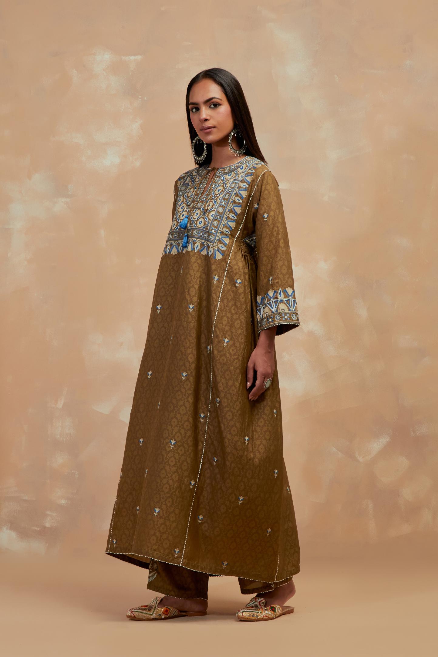 Olive green silk hand block printed A-line long kurta set with all-over multi colored thread embroidery.