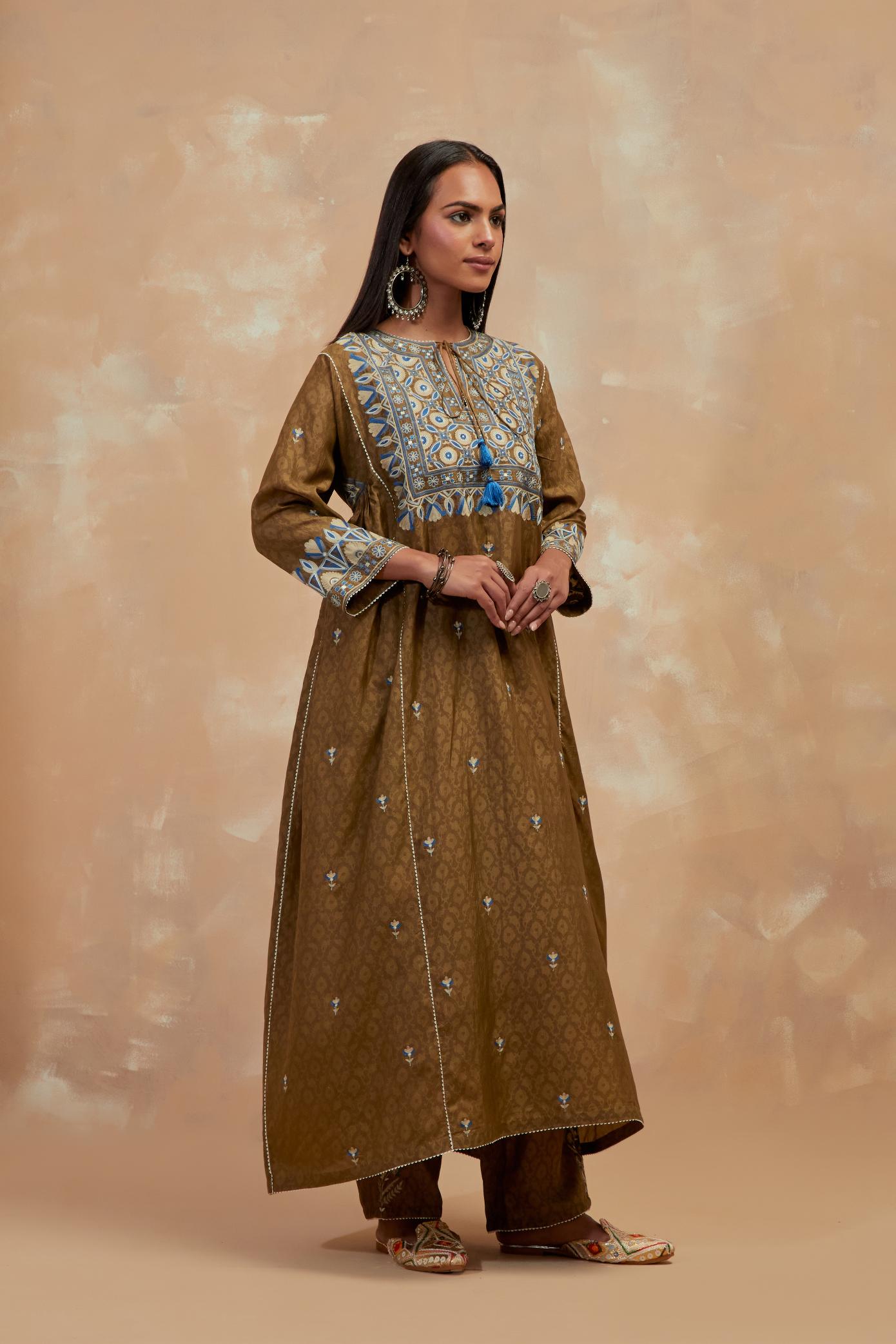 Olive green silk hand block printed A-line long kurta set with all-over multi colored thread embroidery.