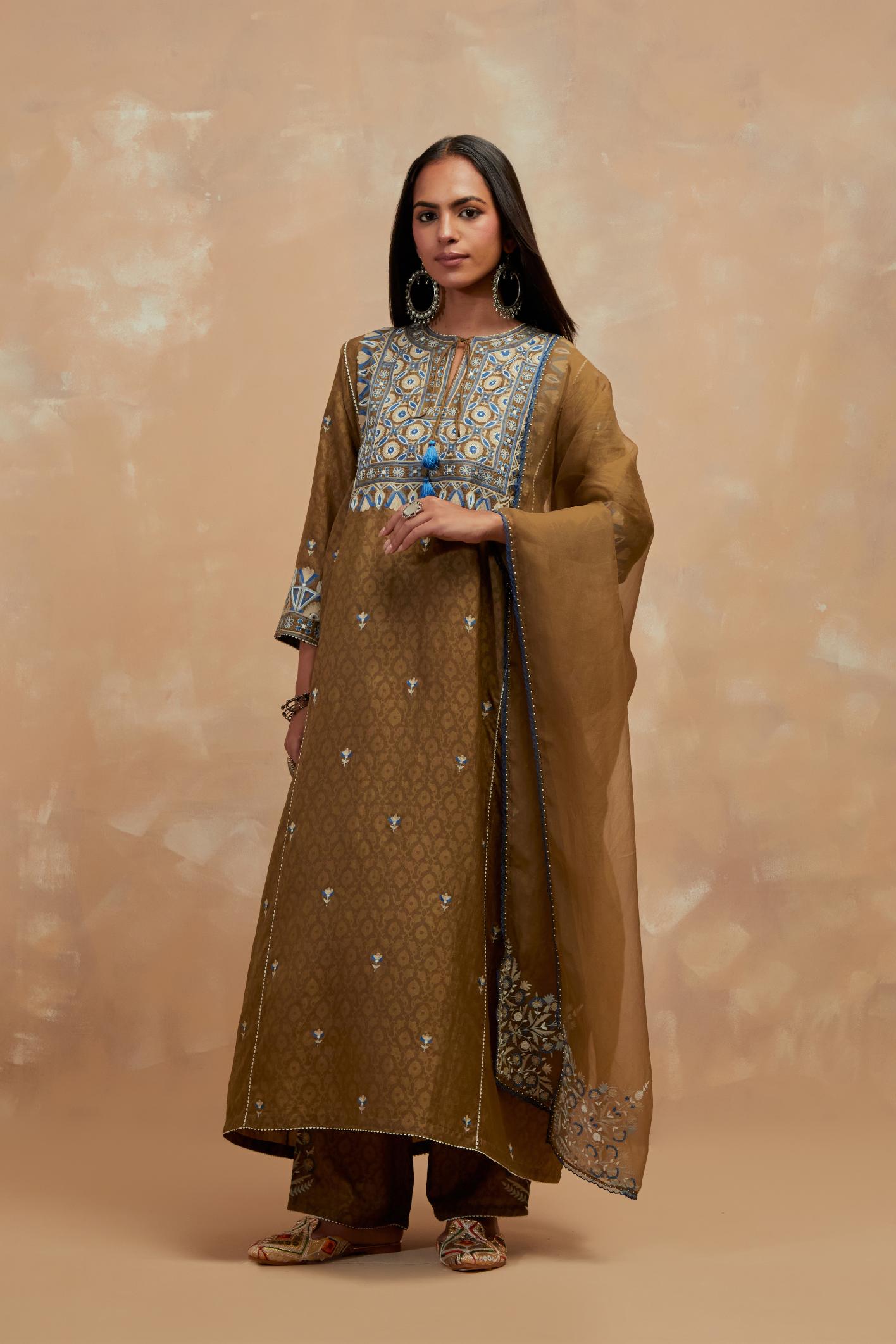 Olive green silk hand block printed A-line long kurta set with all-over multi colored thread embroidery.