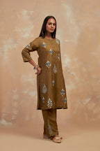 Olive green silk hand block printed short kurta set, highlighted with multi colored silk thread embroidery.