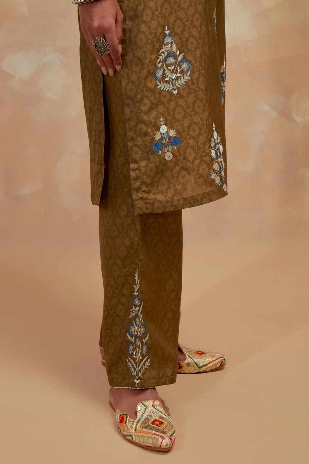 Olive green silk hand block printed short kurta set, highlighted with multi colored silk thread embroidery.