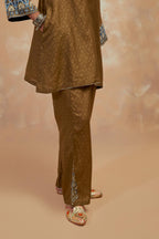 Olive green silk hand block printed short top, highlighted with multi colored silk thread embroidery,  paired with Olive green silk straight pants with all-over hand block print, highlighted with embroidered boota at hem.
