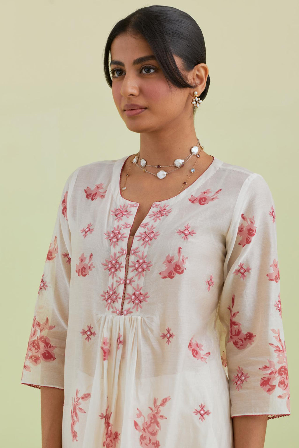 Pink and off-white hand block-printed silk chanderi straight long kurta dress set with pink thread and mirror embroidery.