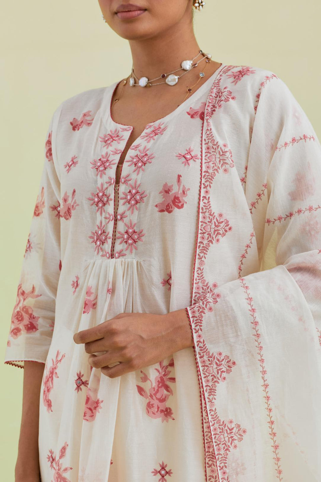 Pink and off-white hand block-printed silk chanderi straight long kurta dress set with pink thread and mirror embroidery.