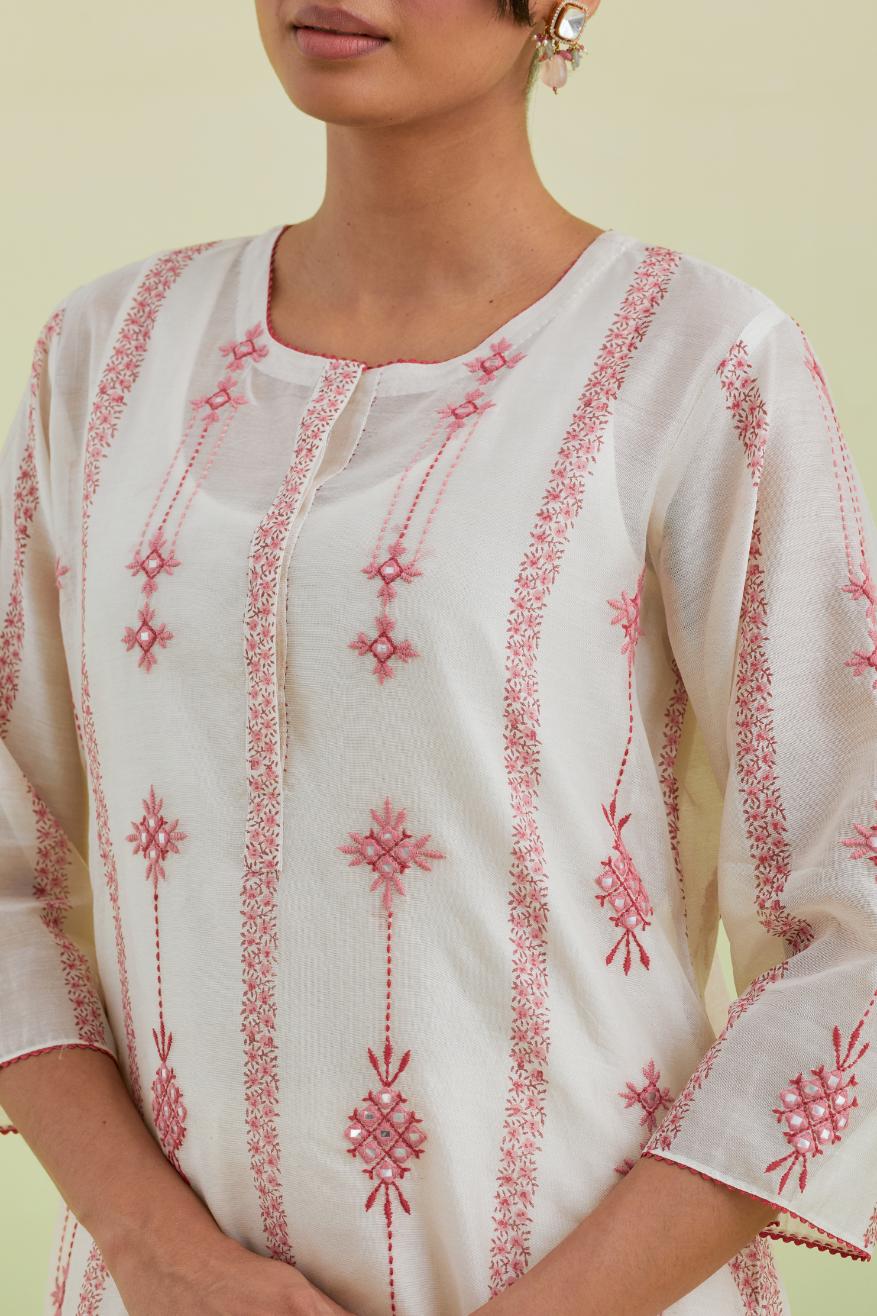 Pink and off-white silk chanderi hand block-printed straight long kurta set with pink thread and mirror embroidery along with kantha work.