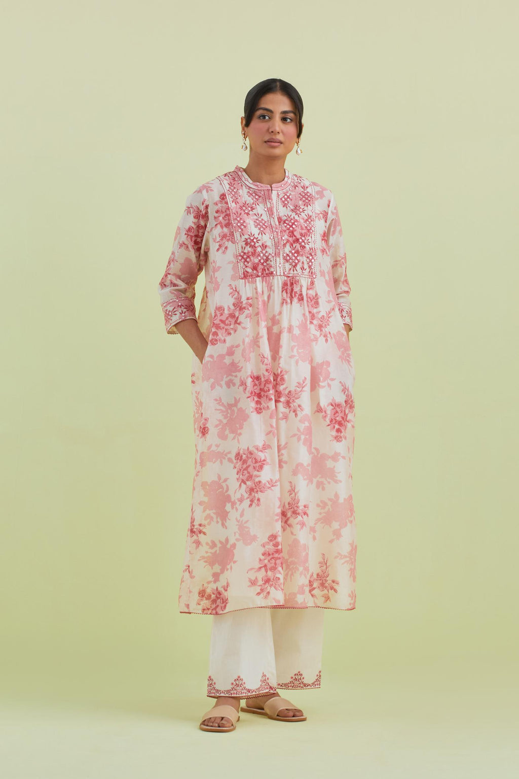 Pink and off-white silk chanderi hand block printed gathered kurta-dress set with thread and mirror work embroidery.