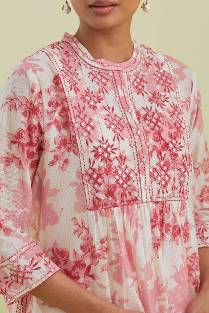 Pink and off-white silk chanderi hand block printed gathered kurta-dress set with thread and mirror work embroidery.