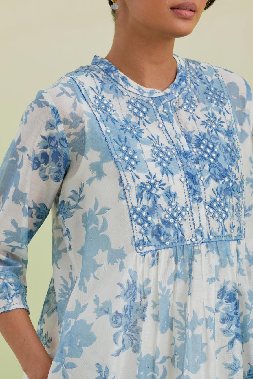 Blue and off-white silk chanderi hand block printed gathered kurta-dress set with thread and mirror work embroidery.