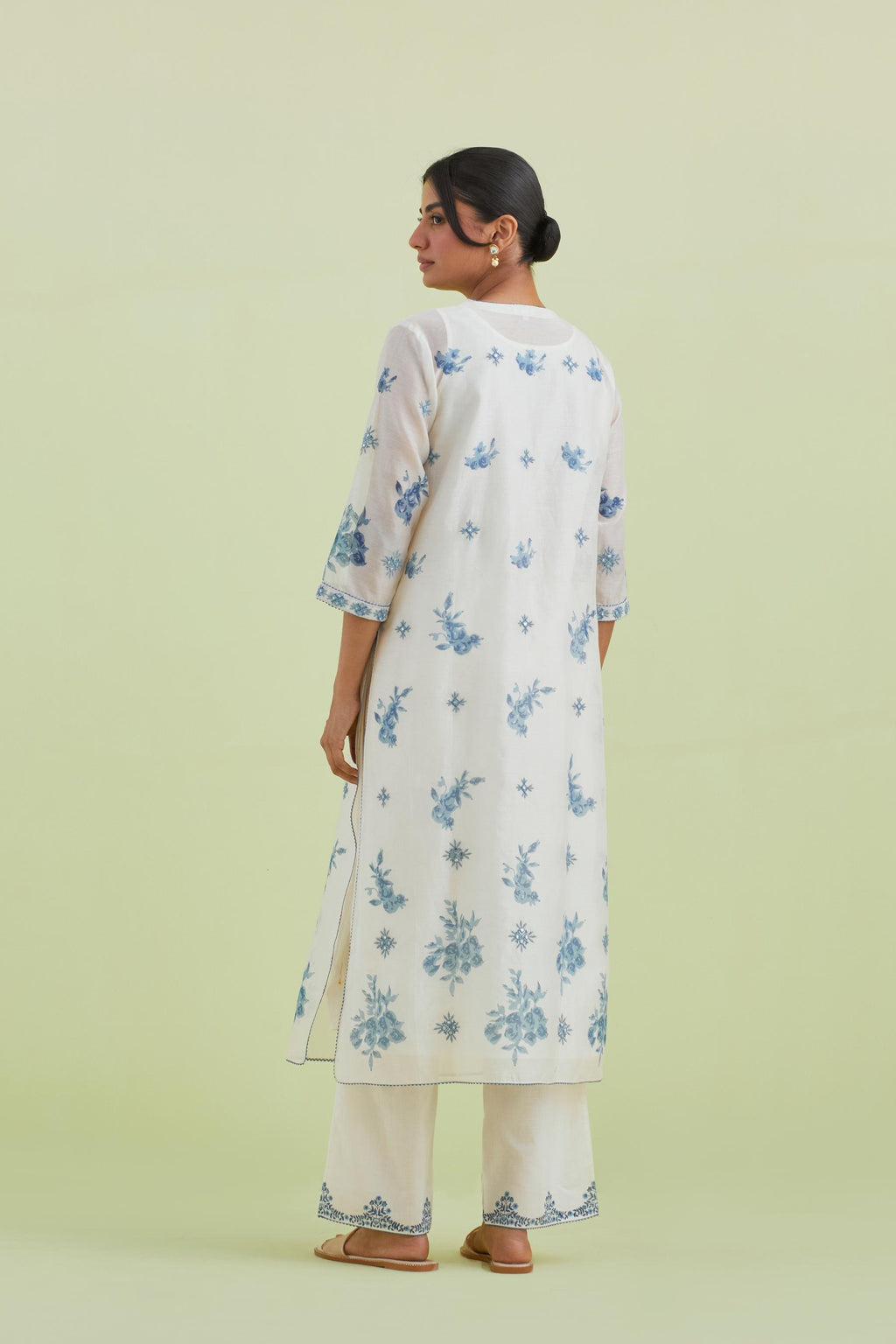 Blue and off-white silk chanderi hand block printed straight kurta set with pin tucks at yoke and all-over blue colored flower.